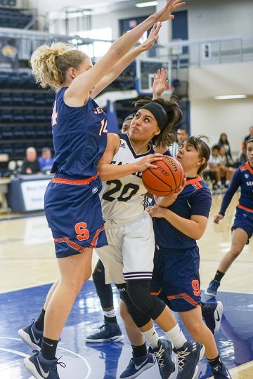 Former Lemoore High standout Taylor Vasquez under the basket in Saturday's game against College of the Sequoias.